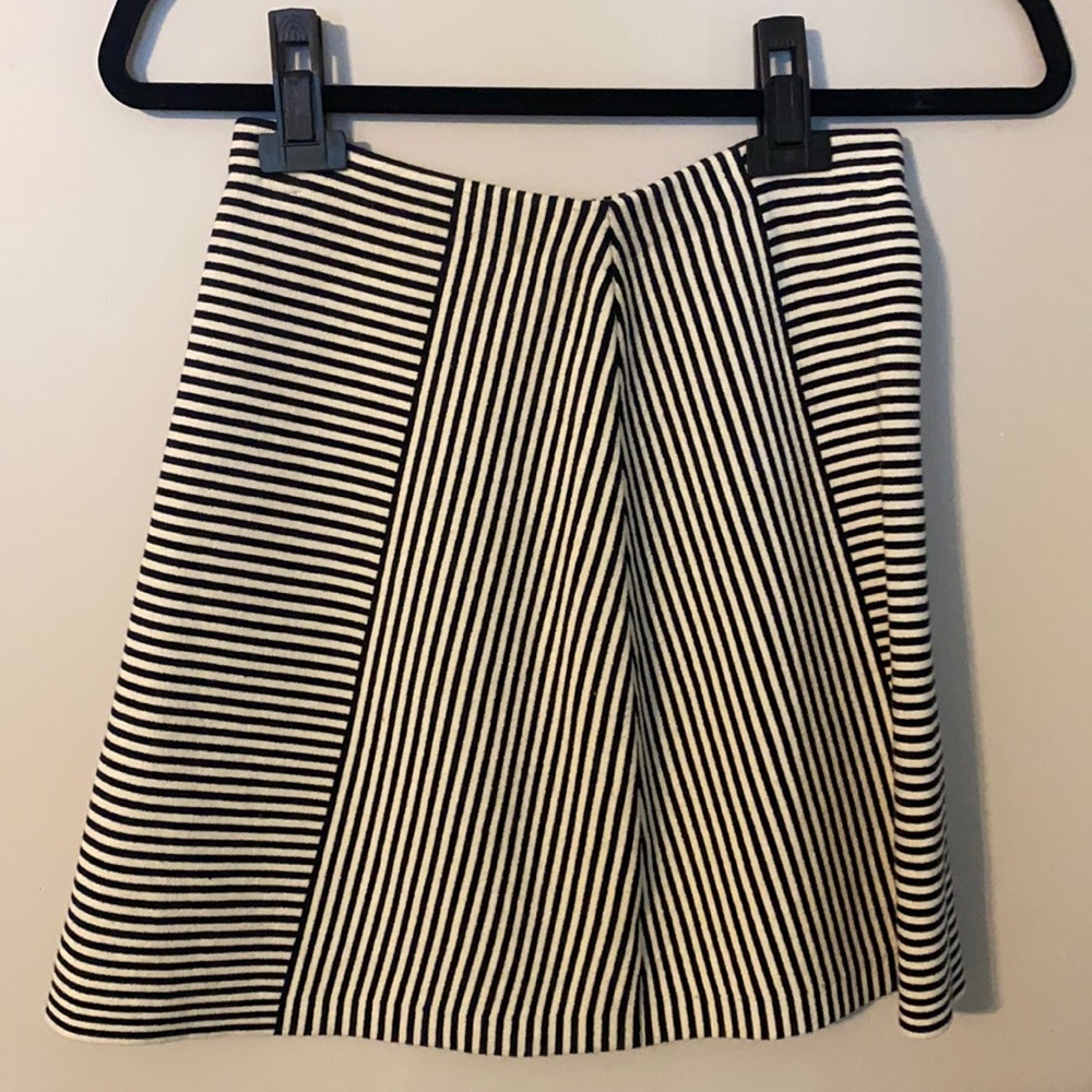 Super cute skirt with elastic waist bank. Spandex